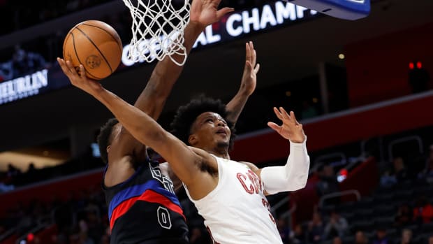 Mar 1, 2024; Detroit, Michigan, USA; Cleveland Cavaliers forward Isaac Okoro (35) shoots on Detroit Pistons center Jalen Duren (0) in the first half at Little Caesars Arena.